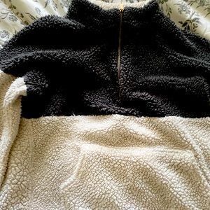 Fuzzy sweater with a pocket